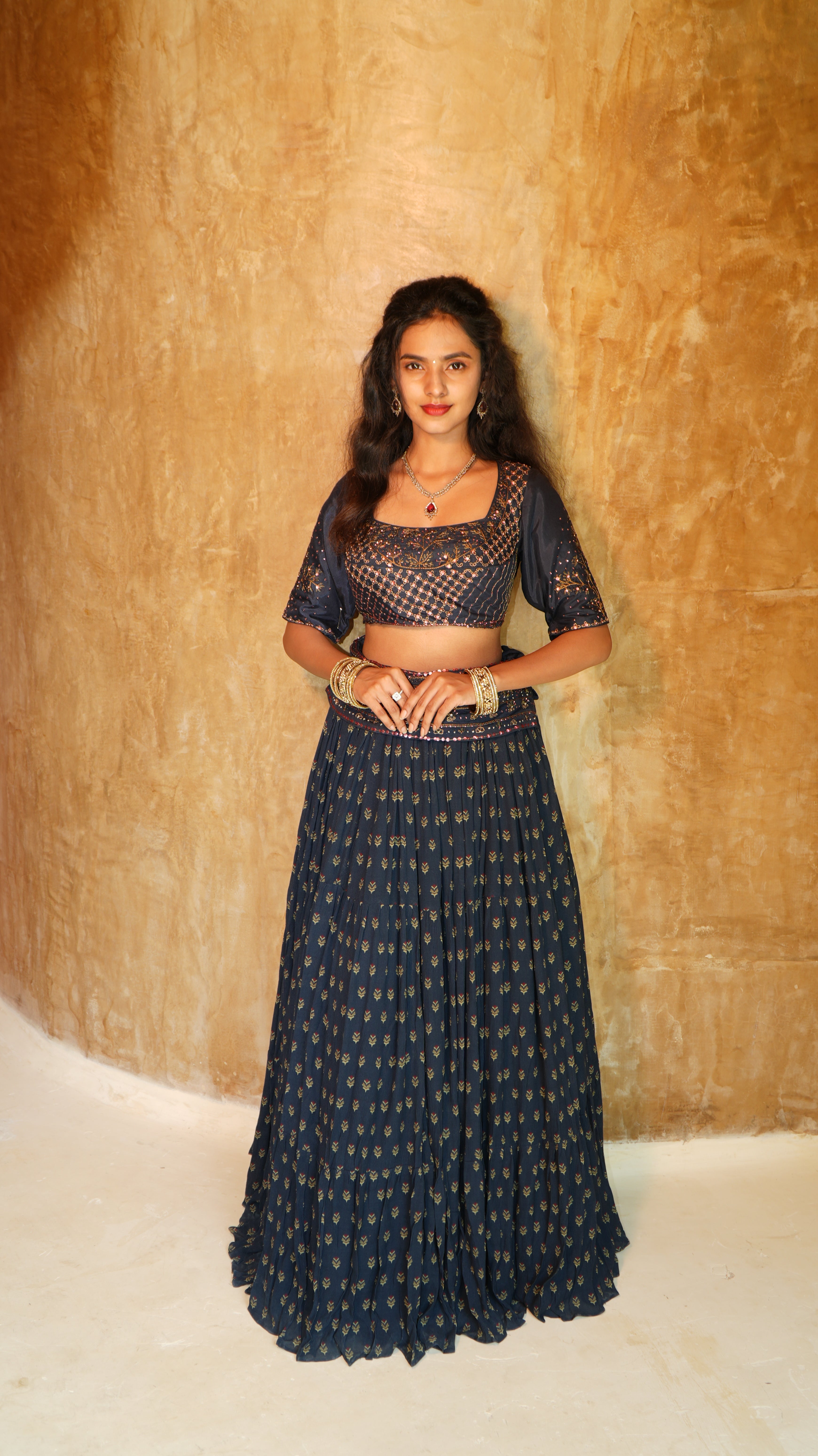 Blue Carnation sequins hand embellished blouse with 5 inch waist belt navy sprig skirt