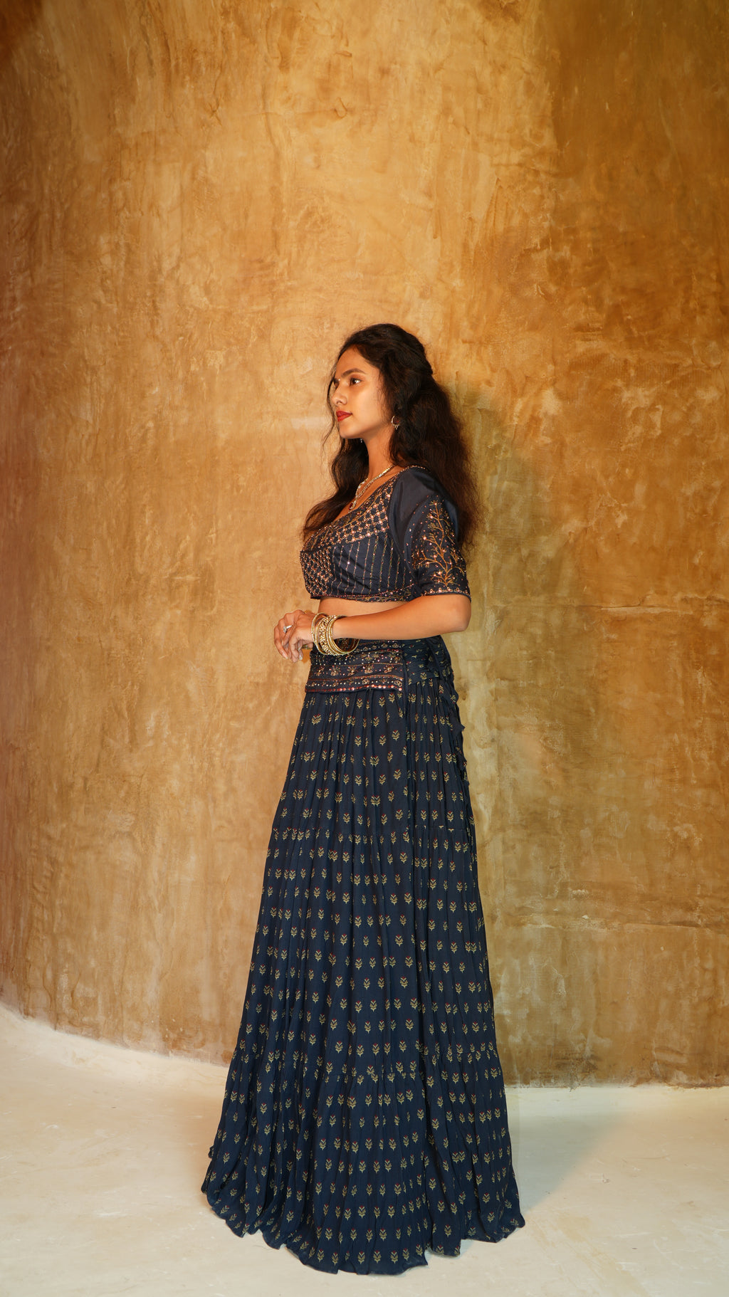 Blue Carnation sequins hand embellished blouse with 5 inch waist belt navy sprig skirt