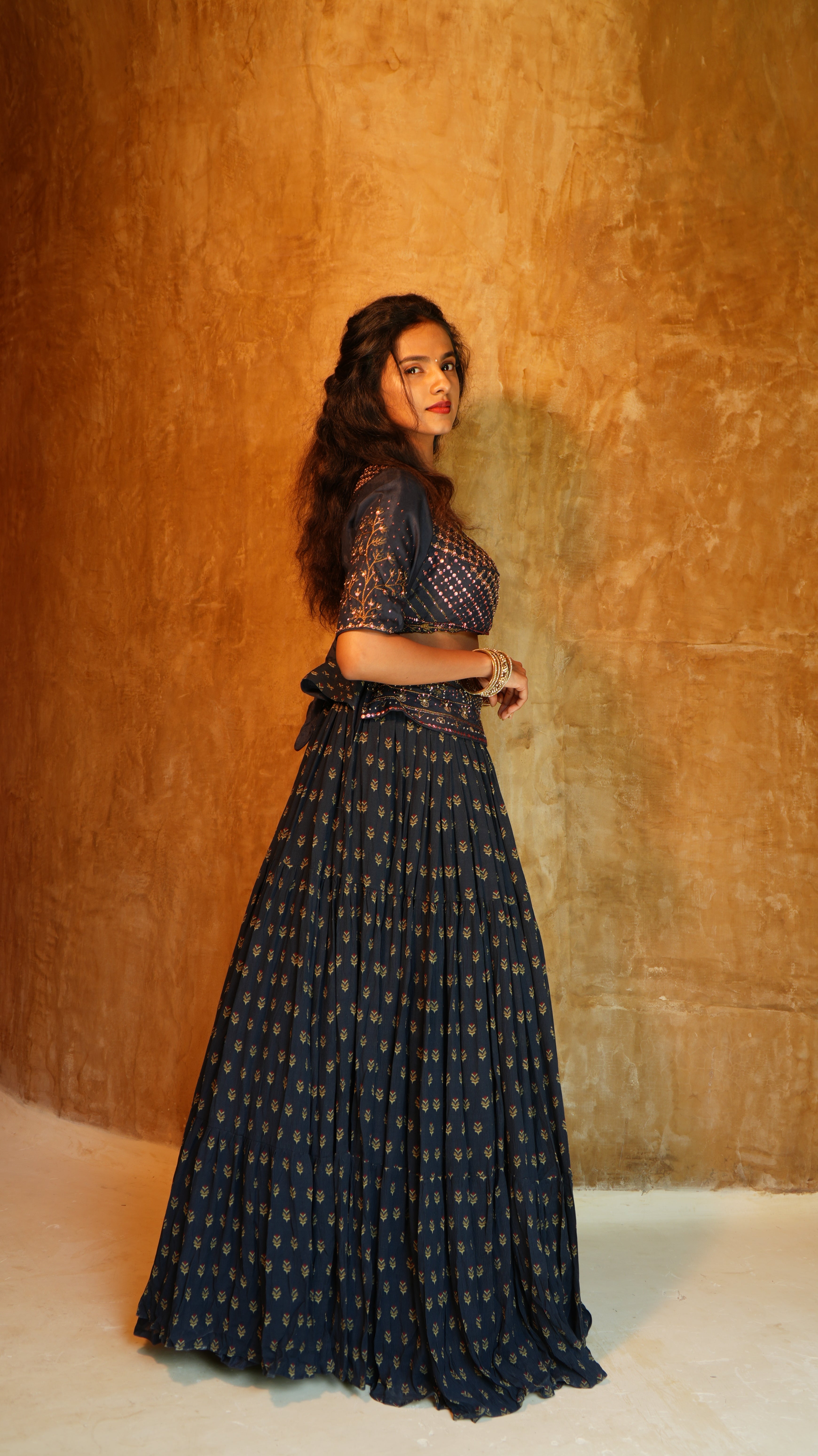 Blue Carnation sequins hand embellished blouse with 5 inch waist belt navy sprig skirt