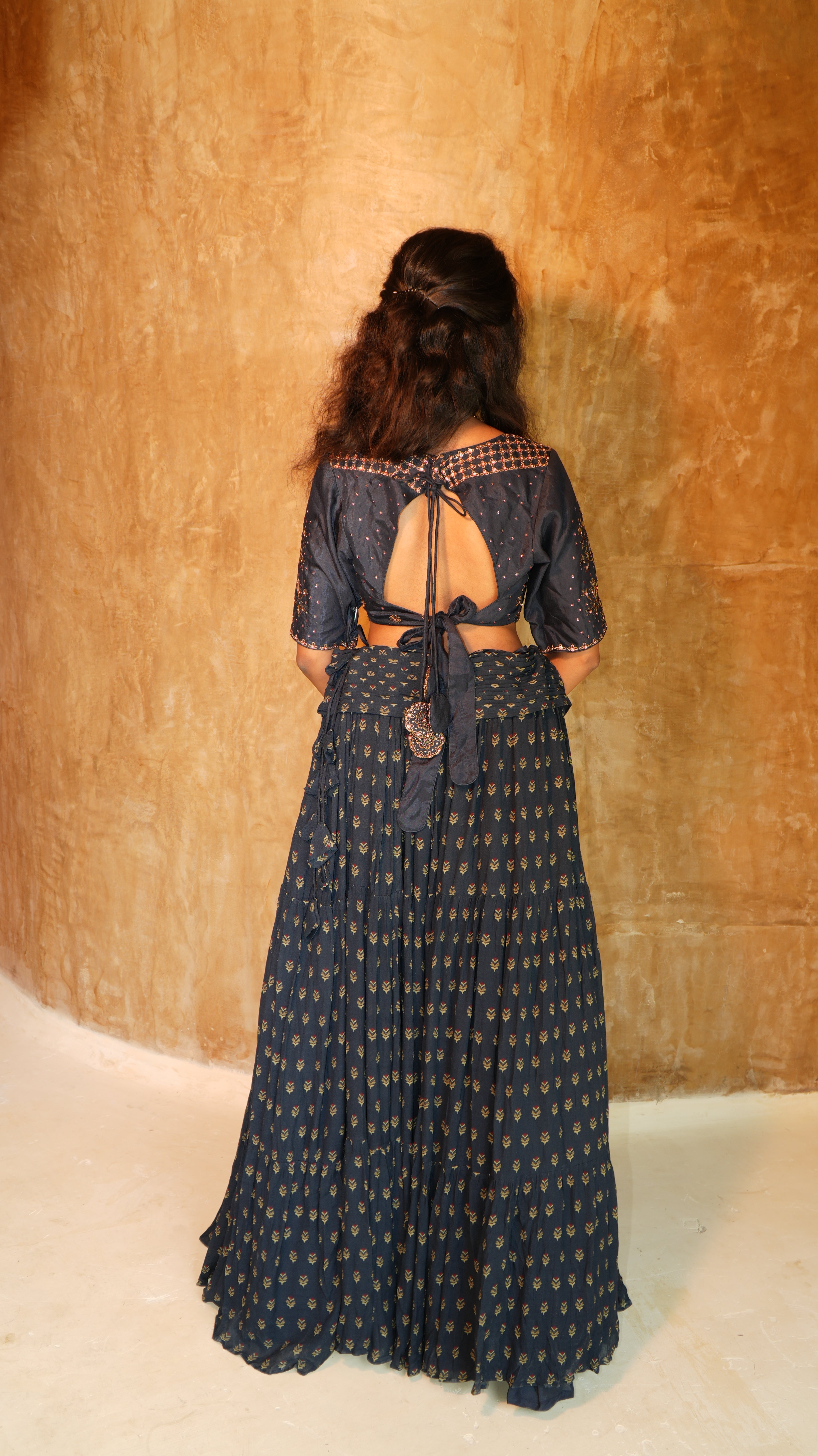 Blue Carnation sequins hand embellished blouse with 5 inch waist belt navy sprig skirt